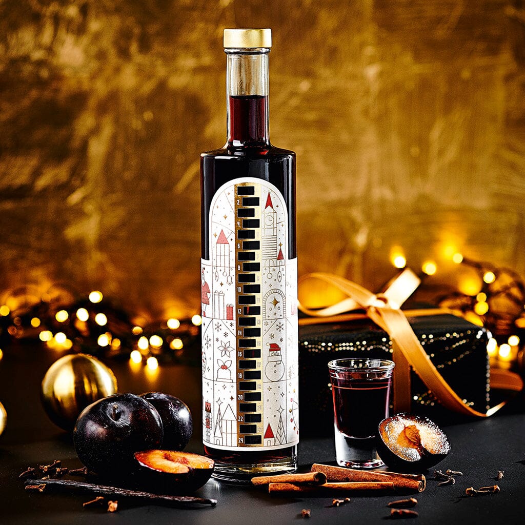WAJOS ADVENTSKALENDER FLASCHE – GEFÜLLT MIT GEWÜRZPFLAUMEN LIKÖR - 500ml - 18% vol